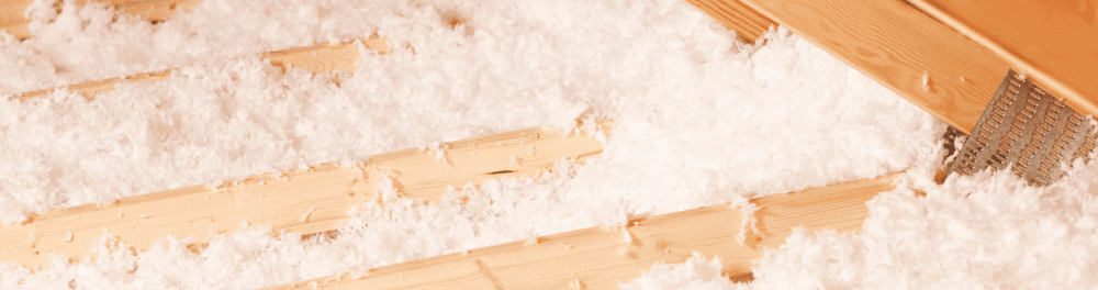 A close up image of freshly blown-in insulation.