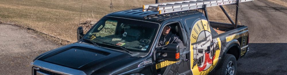 Roofer inside a company truck.