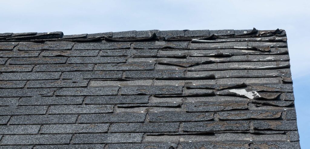 Deteriorating shingles on a roof.