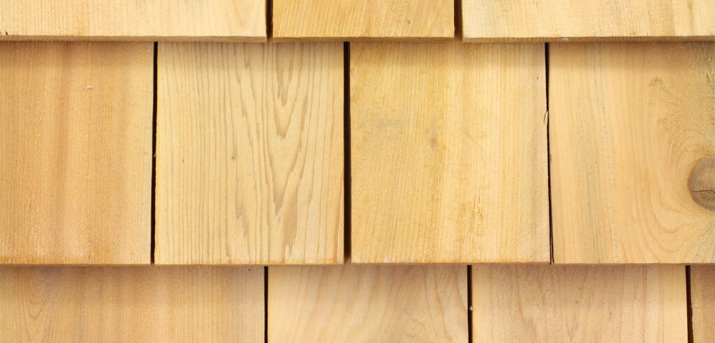 Closeup of cedar shakes on home.