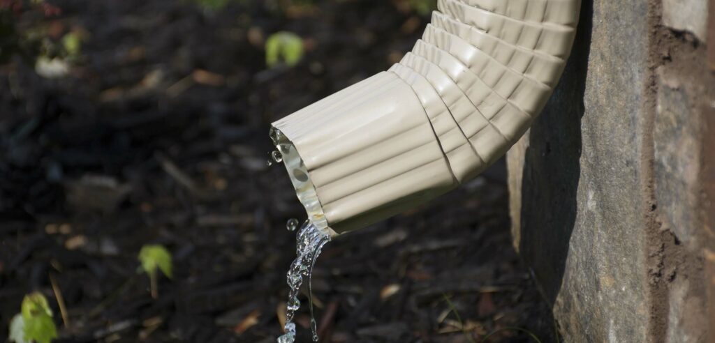 Water pouring from downspout.