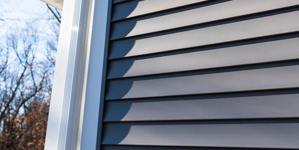 Grey vinyl siding on home.