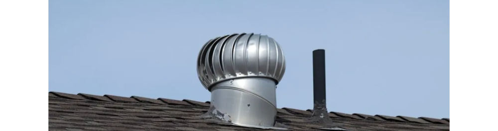A ventilation fan on top of a residential roof. The seals around it are coming apart which could increase the risk of water damage