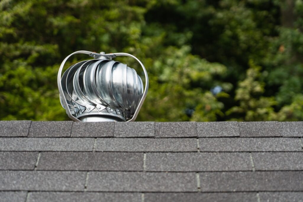 Turbine vent on top of shingle roof on Calgary home