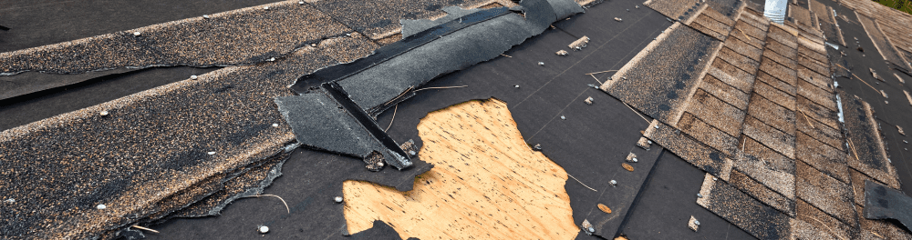 A close up image of a storm battered roof.